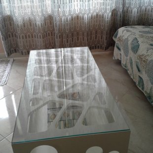 The coffee table is easily moved aside to accomodate an extended sleeper-sofa.