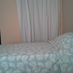 The built-in closet in the bedroom .