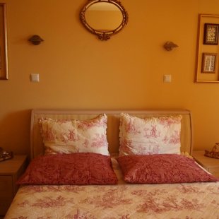 The two large double drawer nightstands are on both sides of the queen bed.