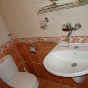 Both bathrooms are tiled floor to ceiling.