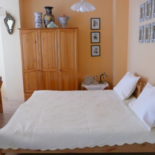 There are 3 twin beds and a sleeper-sofa in the living room.