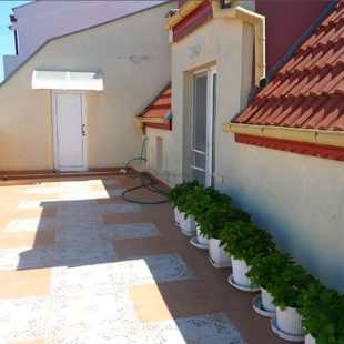 The north terrace provides a cool retreat on a hot summer night.