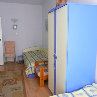 There are two twin beds in the second bedroom