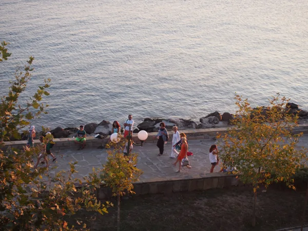 The sea promenade is a popular place for sunbathing on the stone benches or  strolling