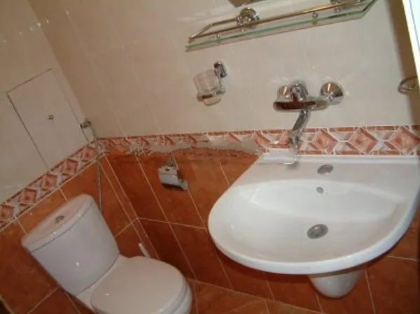 Both bathrooms are tiled floor to ceiling.