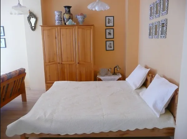 There are 3 twin beds and a sleeper-sofa in the living room.
